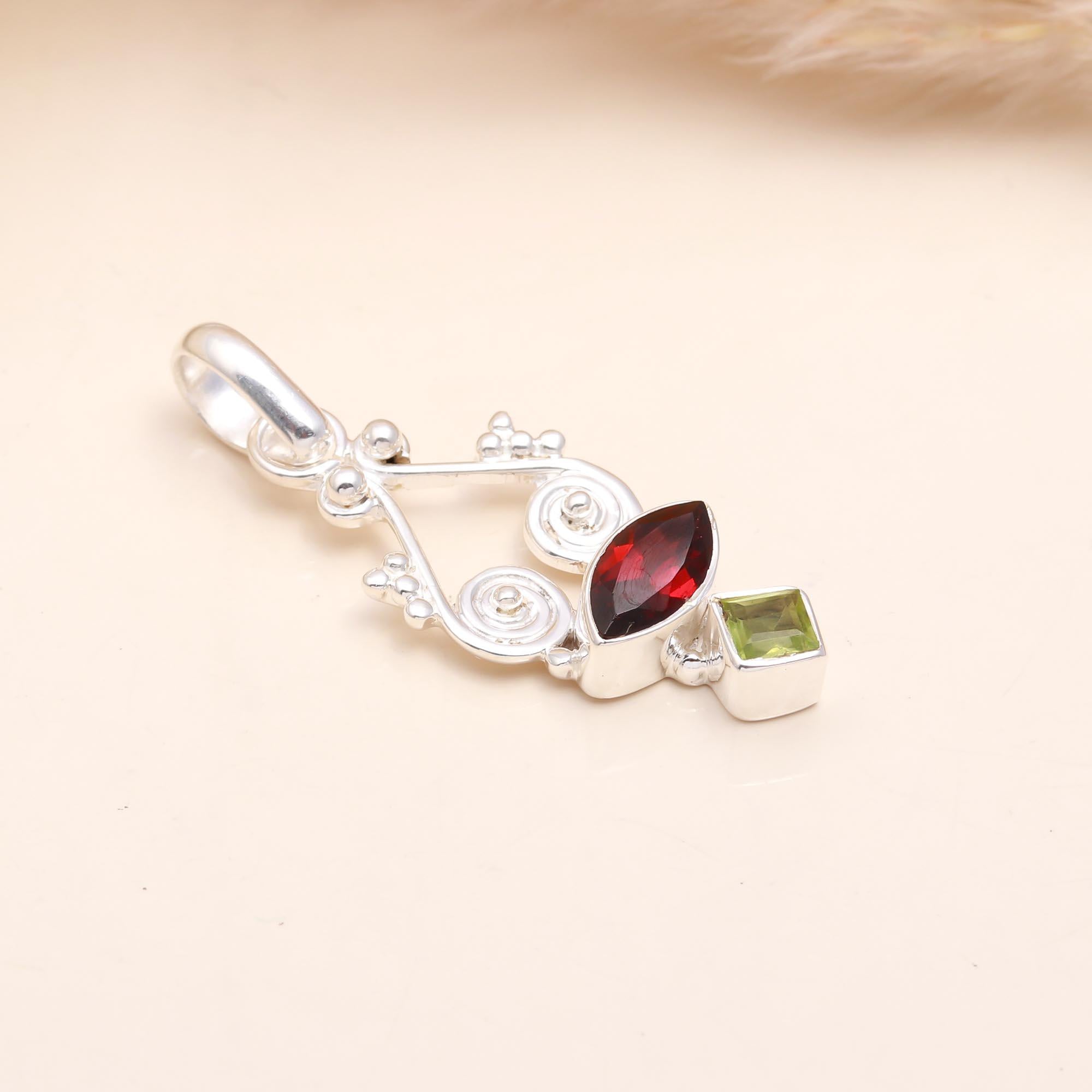 The Garnet Helix: Abstract Garnet & Peridot Silver Pendant