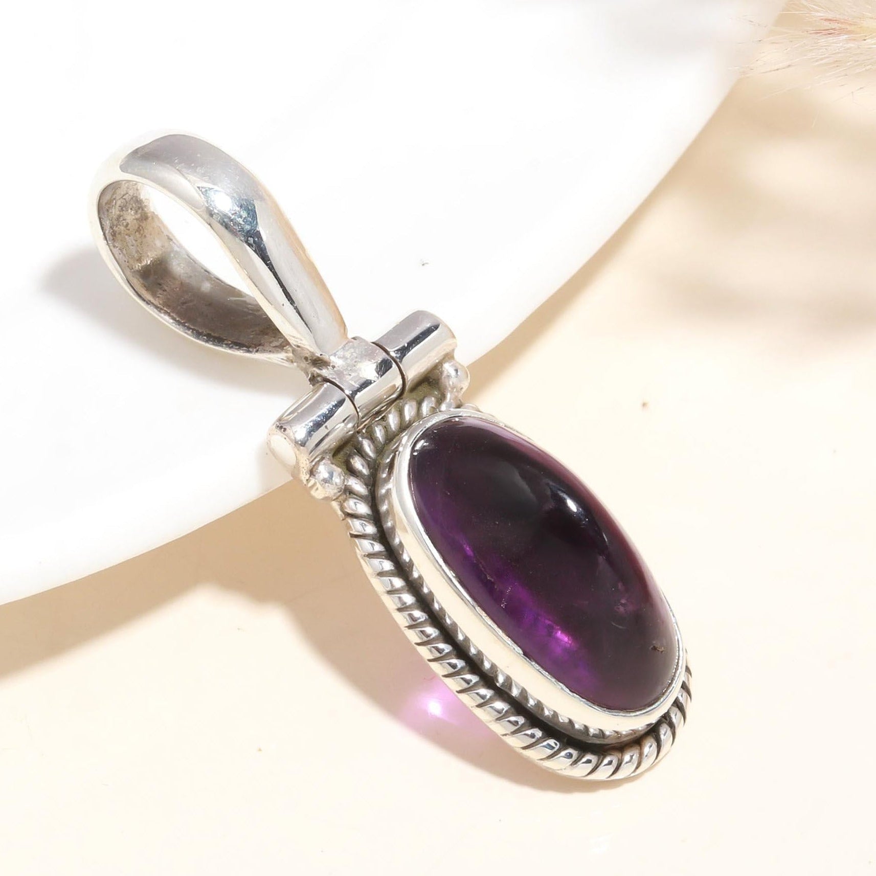 A 925 Sterling Silver pendant with a deep purple Amethyst gemstone, featuring vintage-inspired handcrafted silverwork.