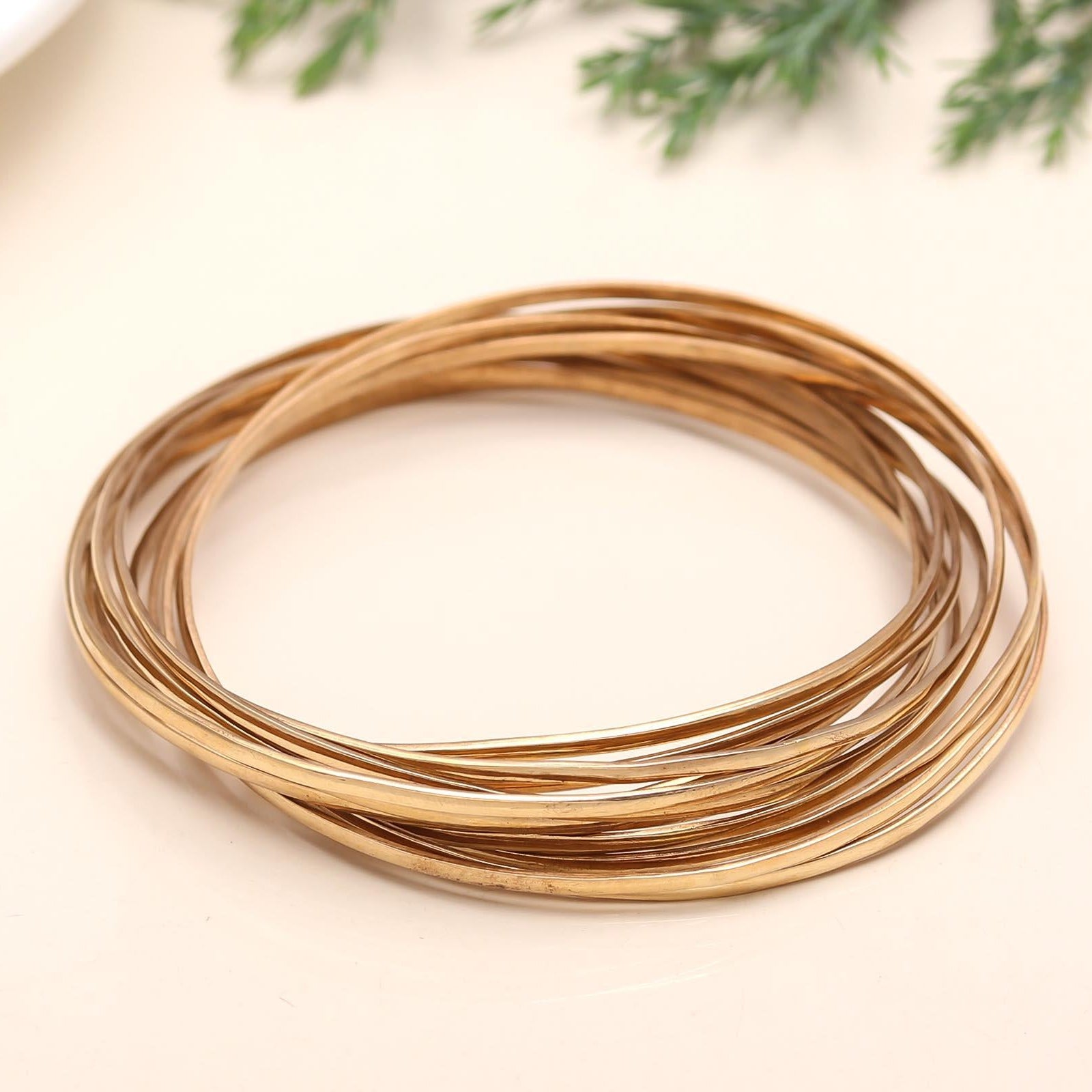 The Golden Cascade: Multi-Strand Gold Bangle Set