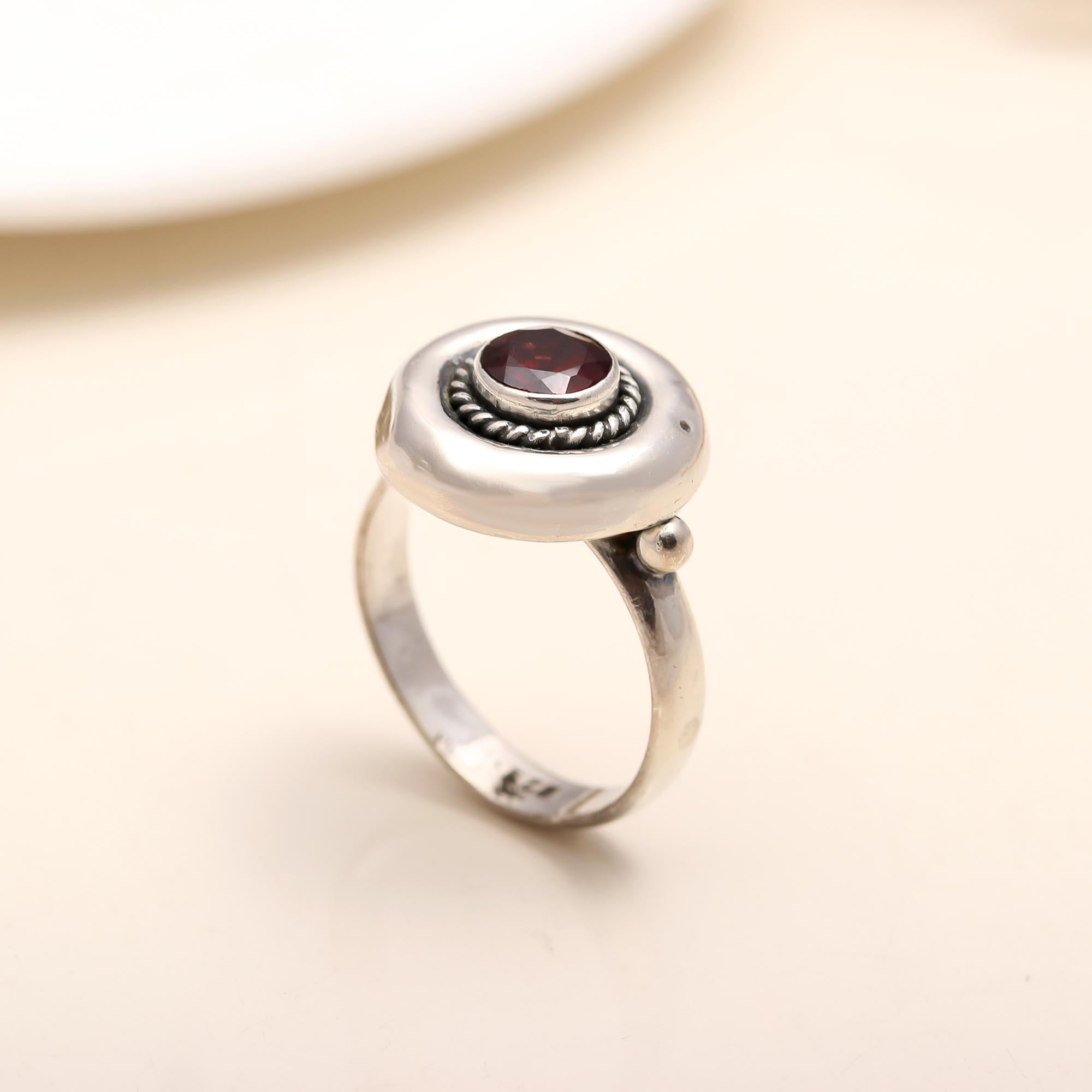 Classic round garnet ring with textured silver band