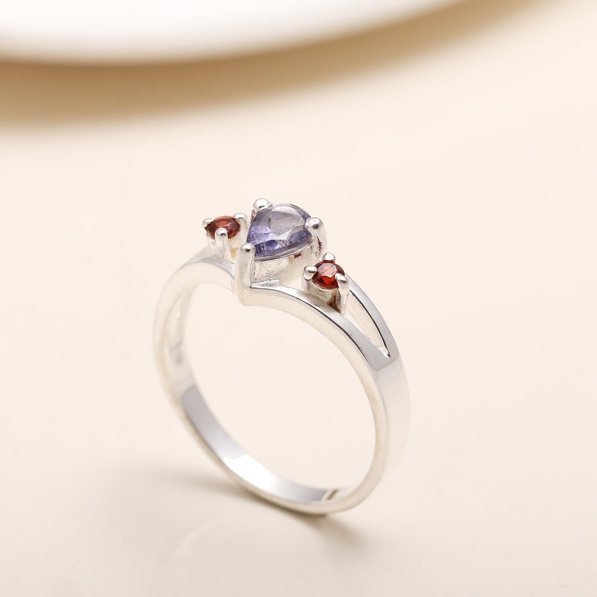 Handcrafted iolite and garnet silver ring for bold style