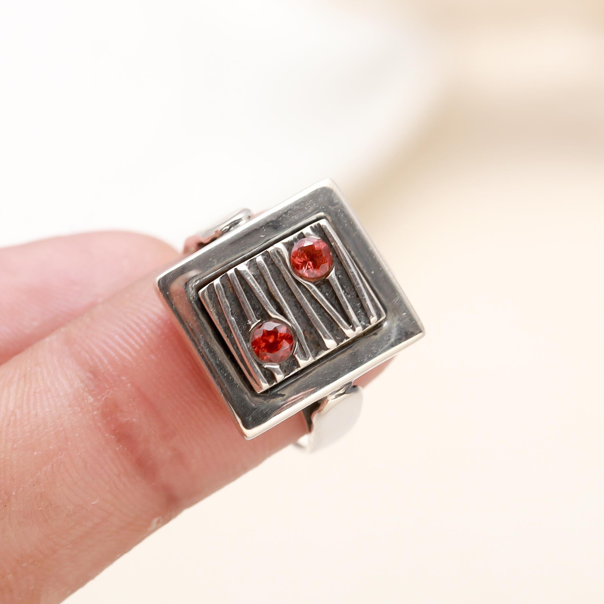 Bold statement garnet ring with polished silver band