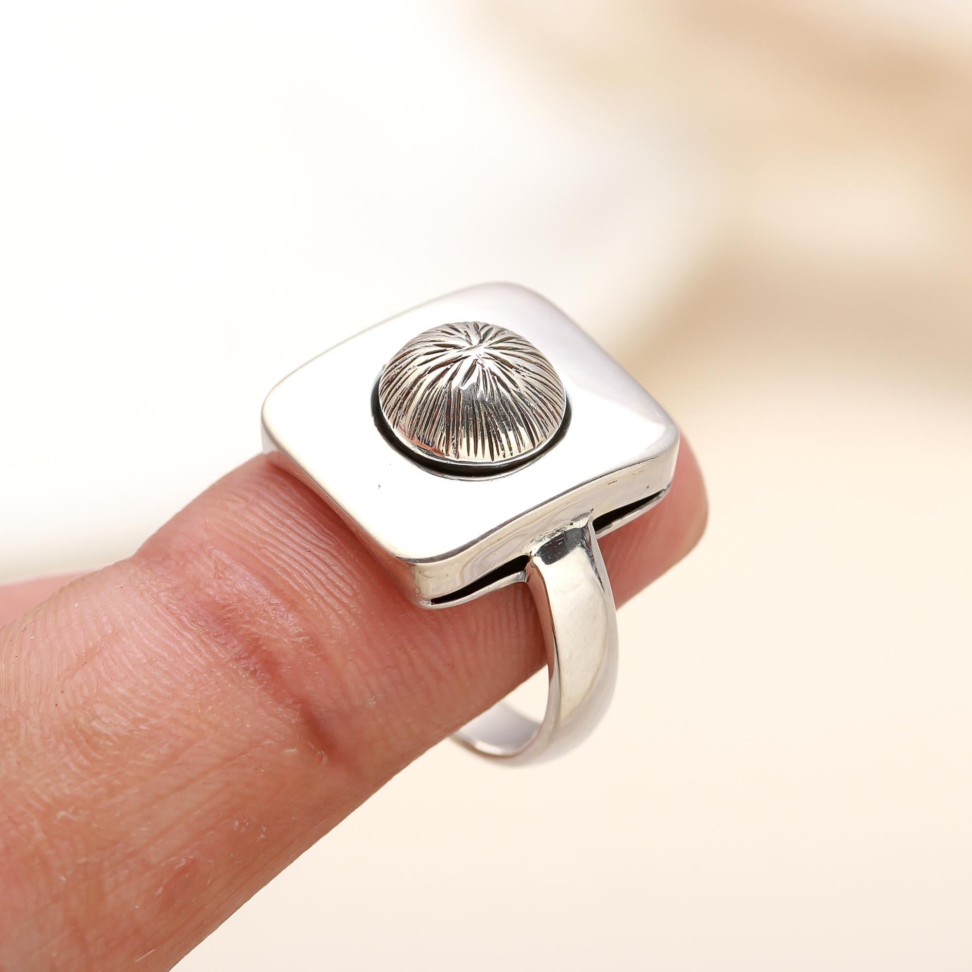 Modern geometric silver ring with hammered dome center