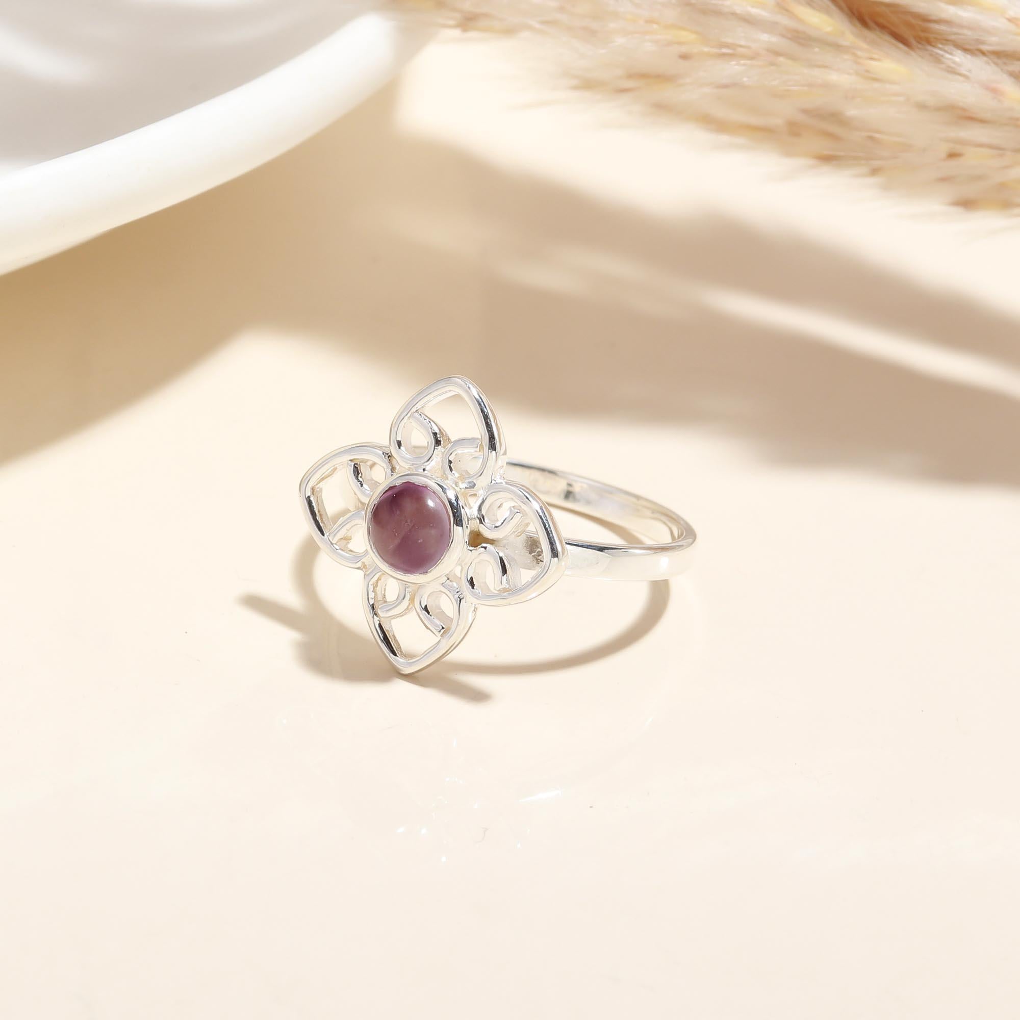 Close-up of Amethyst cabochon floral filigree ring