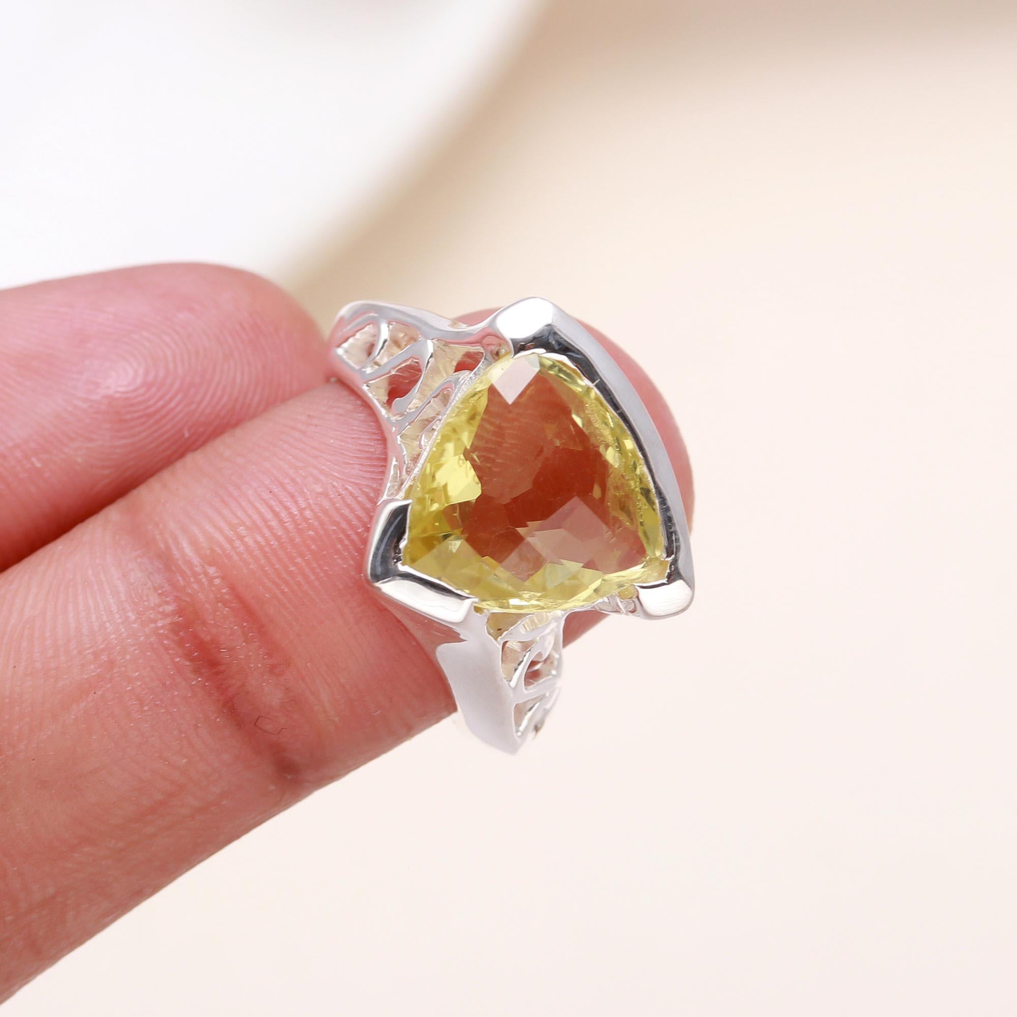 Elegant lemon quartz filigree ring on finger