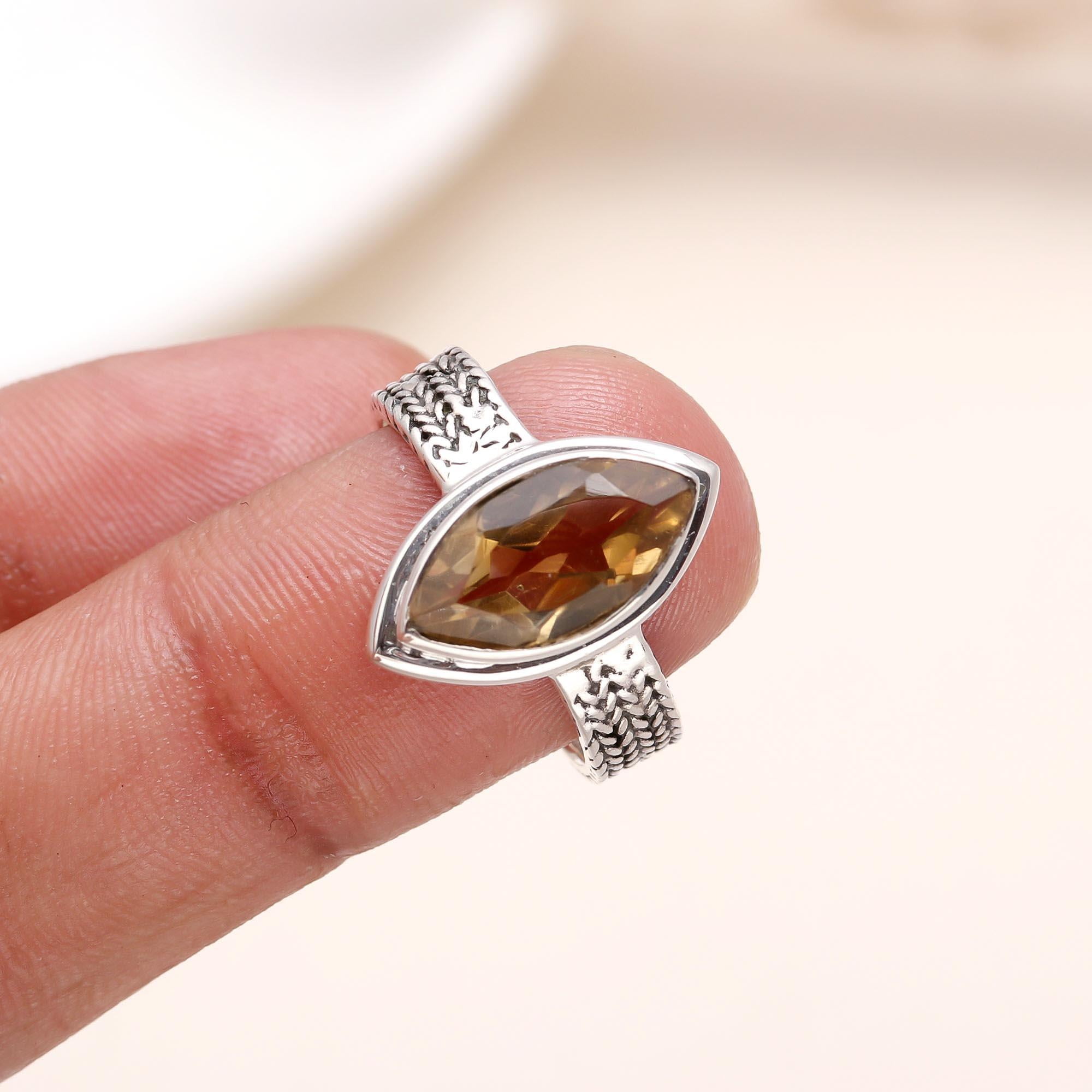 Elegant citrine marquise ring on finger