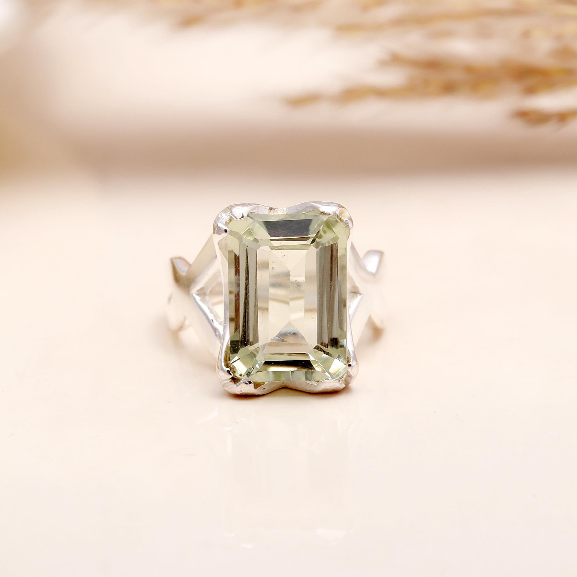 Close-up of emerald cut green amethyst crown silver ring