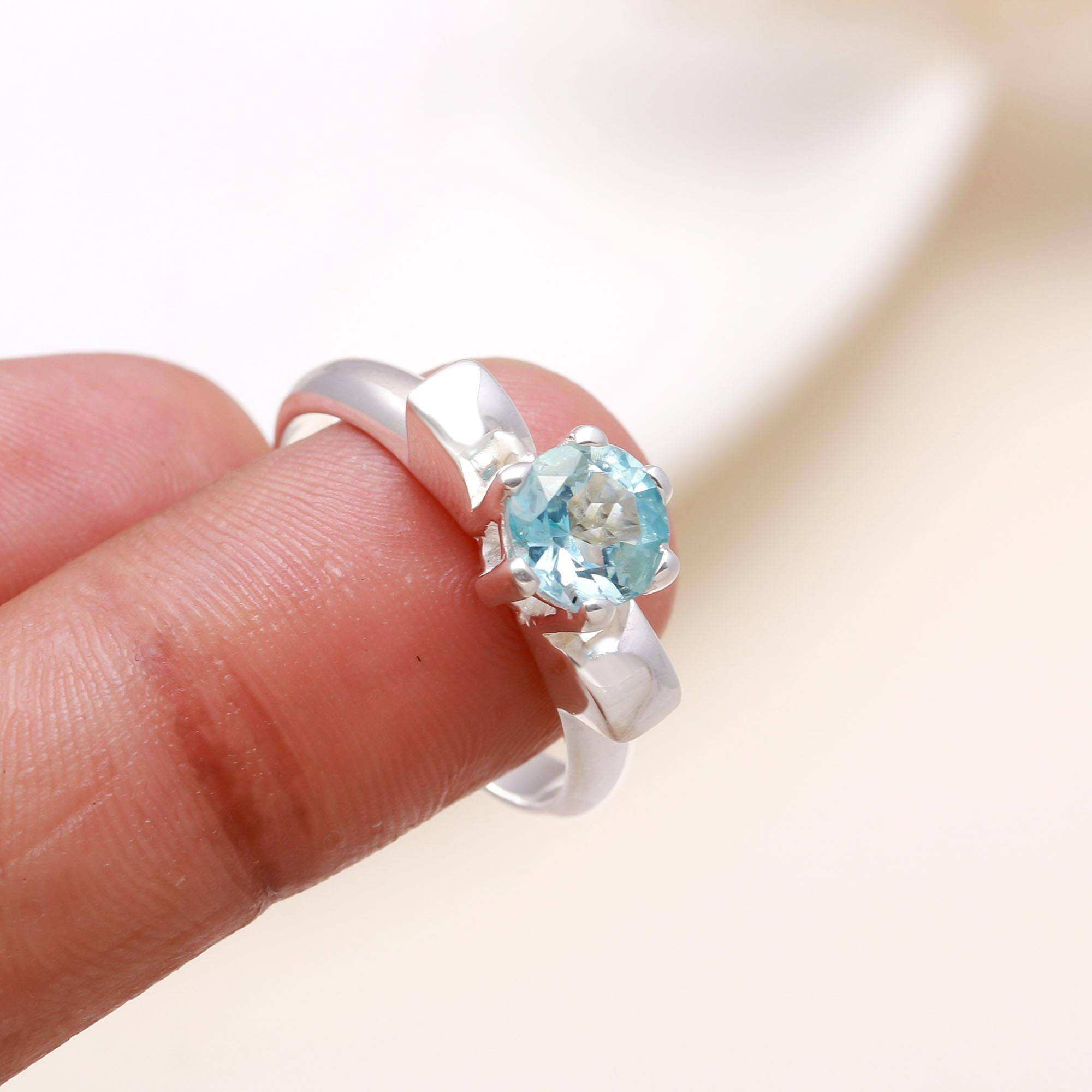 Elegant round aquamarine gemstone ring on finger