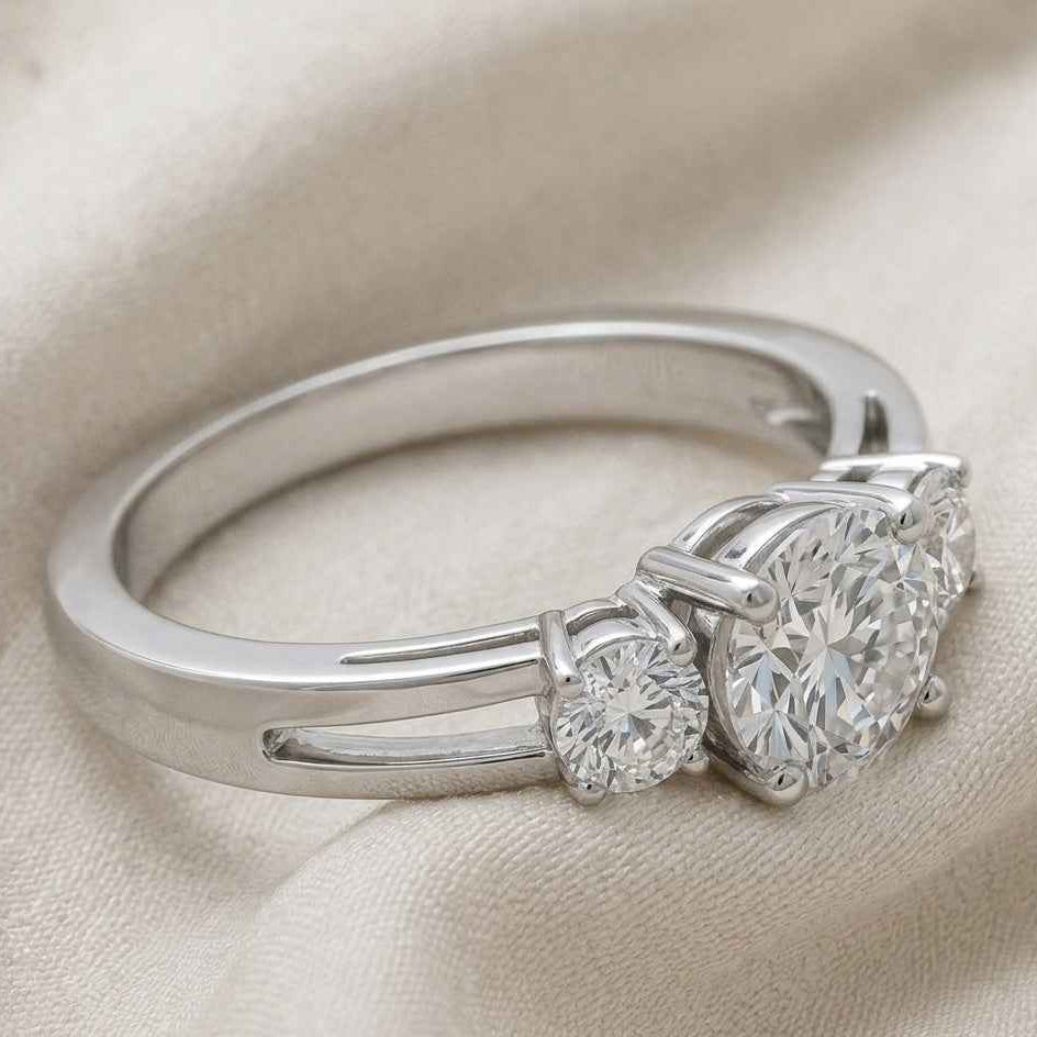 The Triad Glow: 0.7ct Round Moissanite Three-Stone Ring