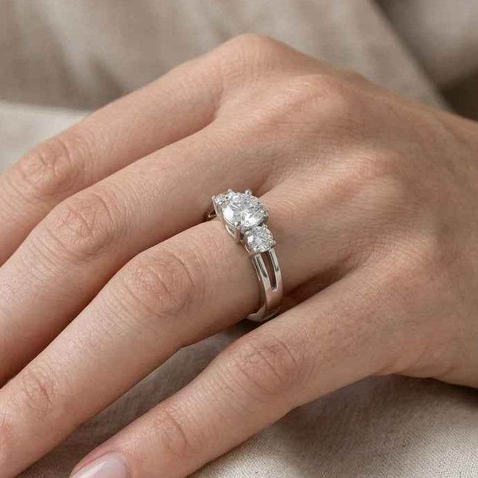 The Triad Glow: 0.7ct Round Moissanite Three-Stone Ring